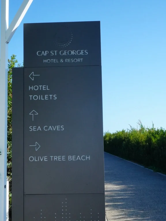 Cap St Georges Hotel & Resort signpost to the hotel, Sea Caves and Olive Tree Beach