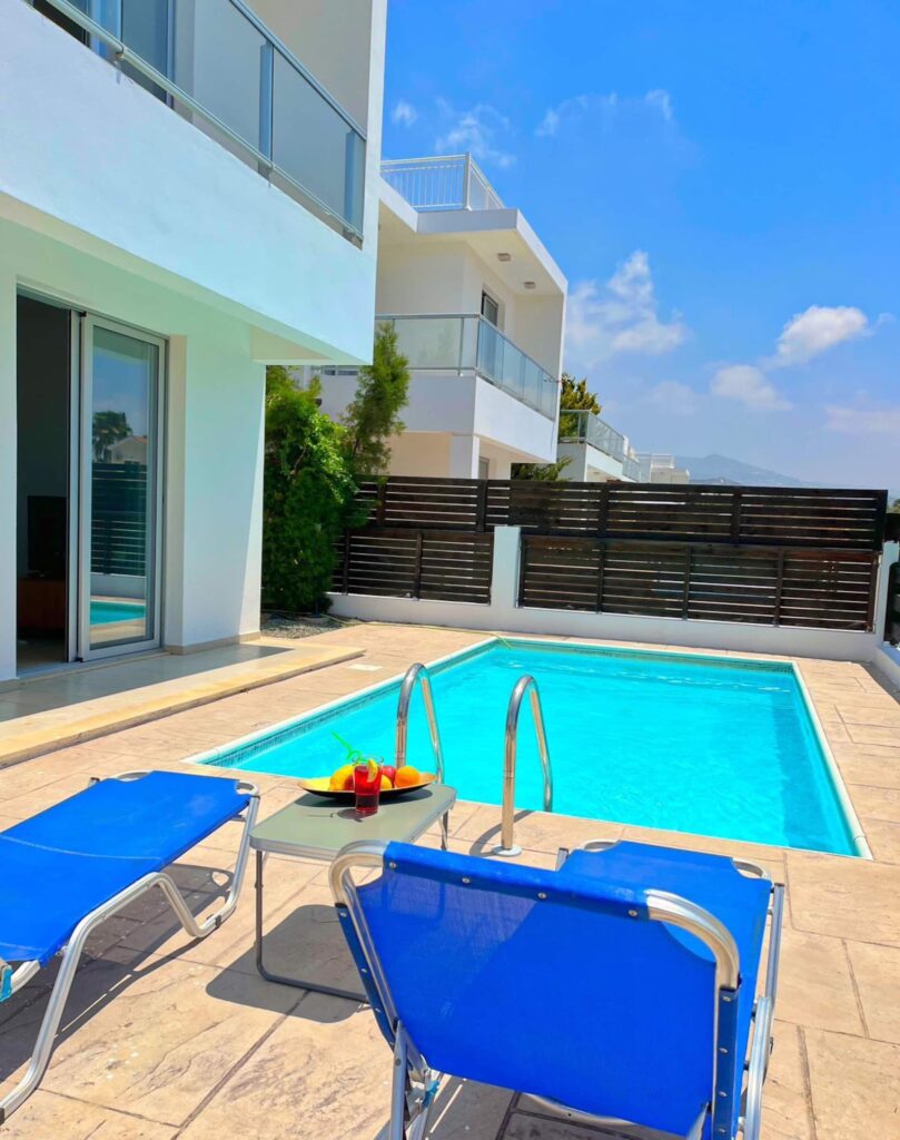 Private pool with sun loungers at Villa Asteria